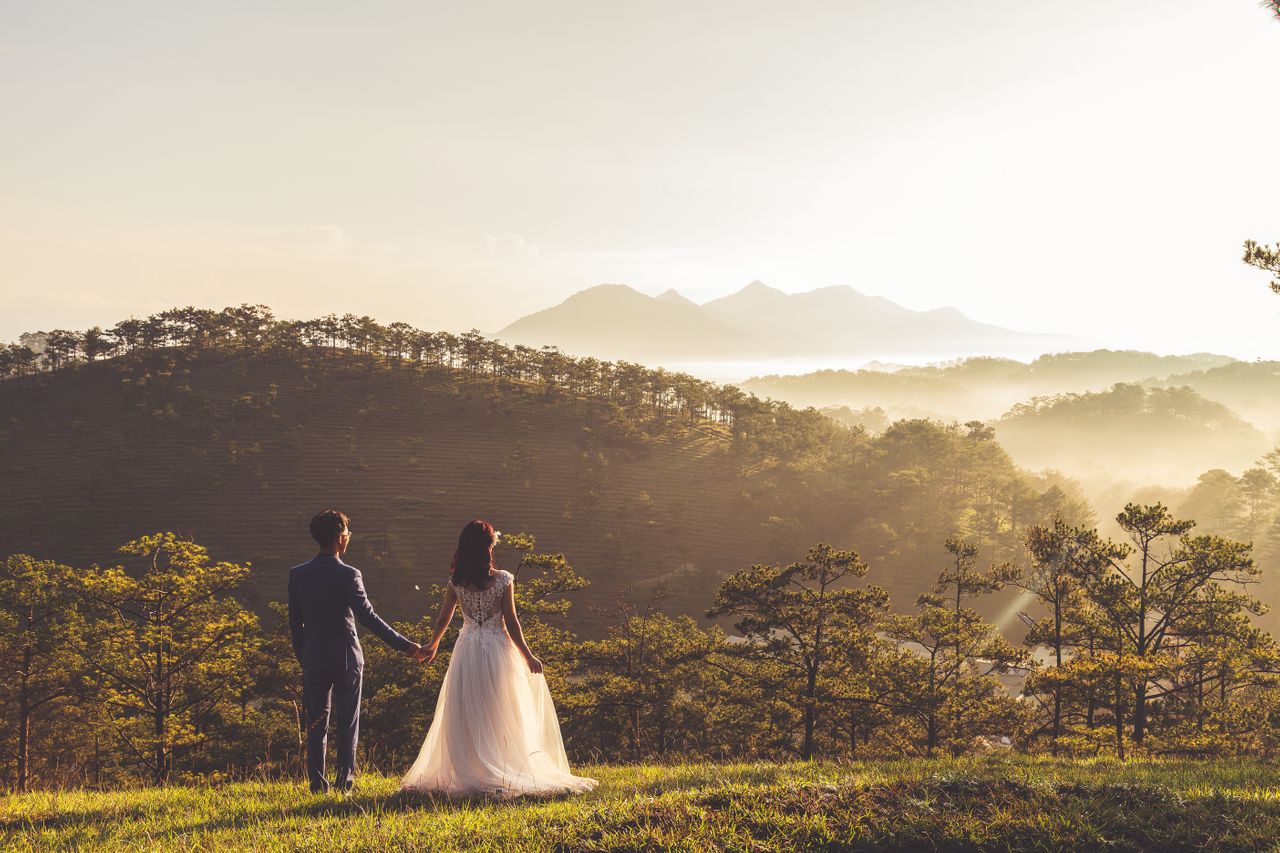 A newly married couple takes in the view after their wedding ceremony
