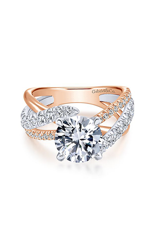 A white and rose gold sidestone engagement ring with a round cut diamond at the center