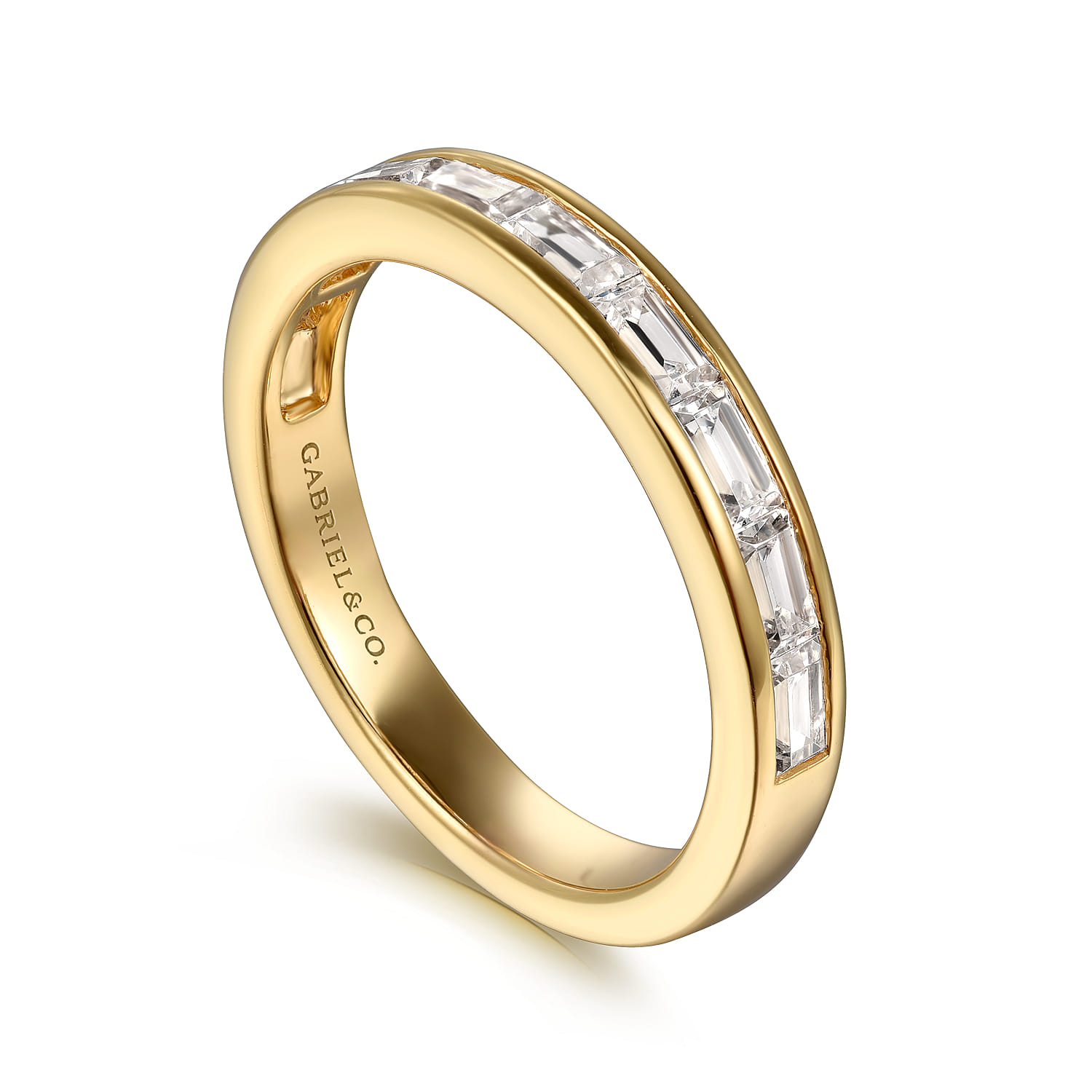 A yellow gold ½ way wedding band with baguette cut diamonds.