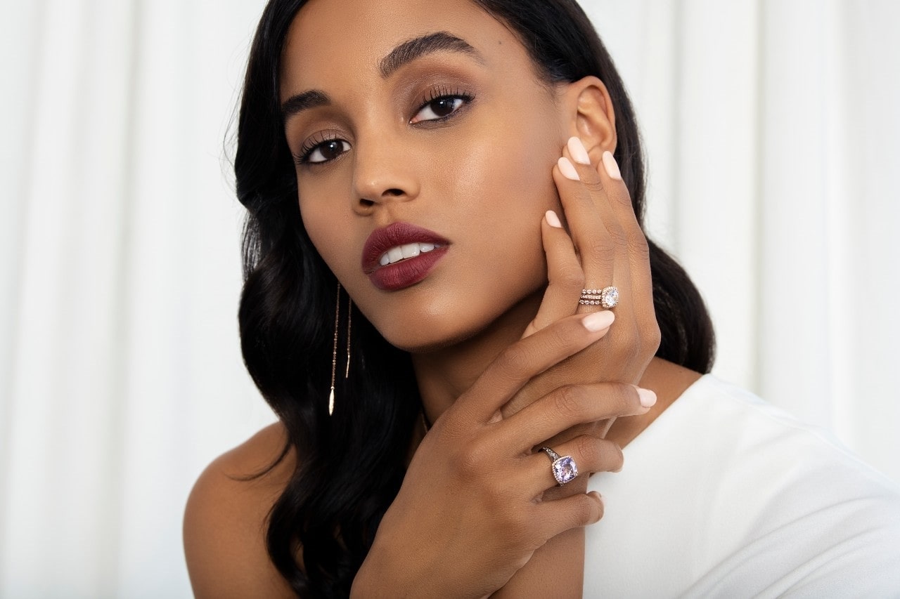 Image of a woman wearing fashion rings by TACORI