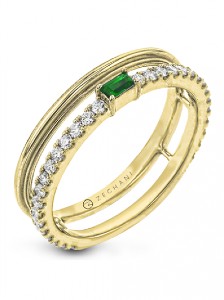 Yellow gold double band with an emerald and diamond details