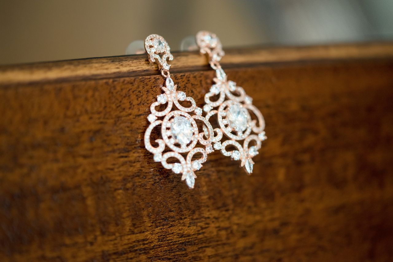 Earrings with delightful intricate metalwork and diamond accents