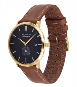 A casual Movado watch features a gold case and chestnut brown leather band