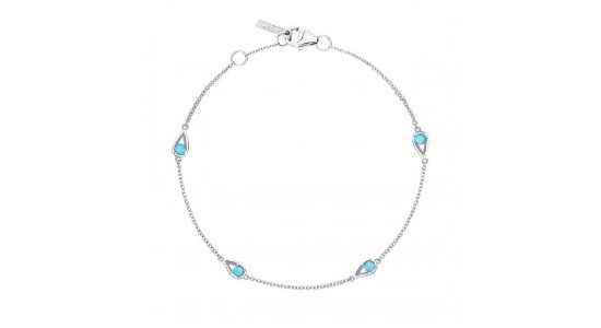 A turquoise station bracelet with silver chain and geometric details