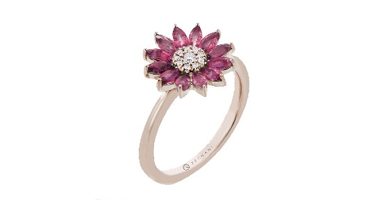 A floral ring with rose gold band and ruby petals