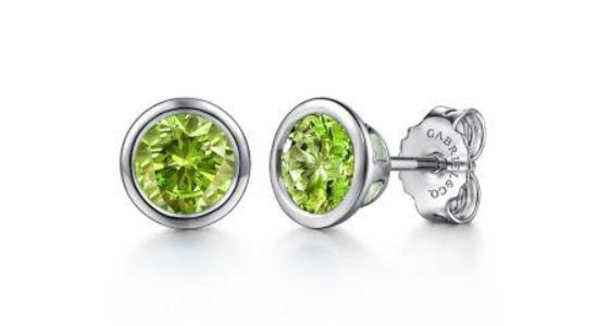 A pair of peridot stud earrings with silver setting