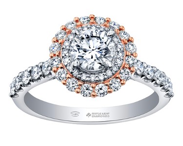 A double halo diamond engagement ring from Maple Leaf Diamonds features side stones and rose gold prong accents